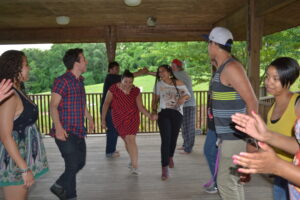 Our wacky workshoppers enjoy an old-fashioned Highlander square dance.  Photo by Donald Jones.